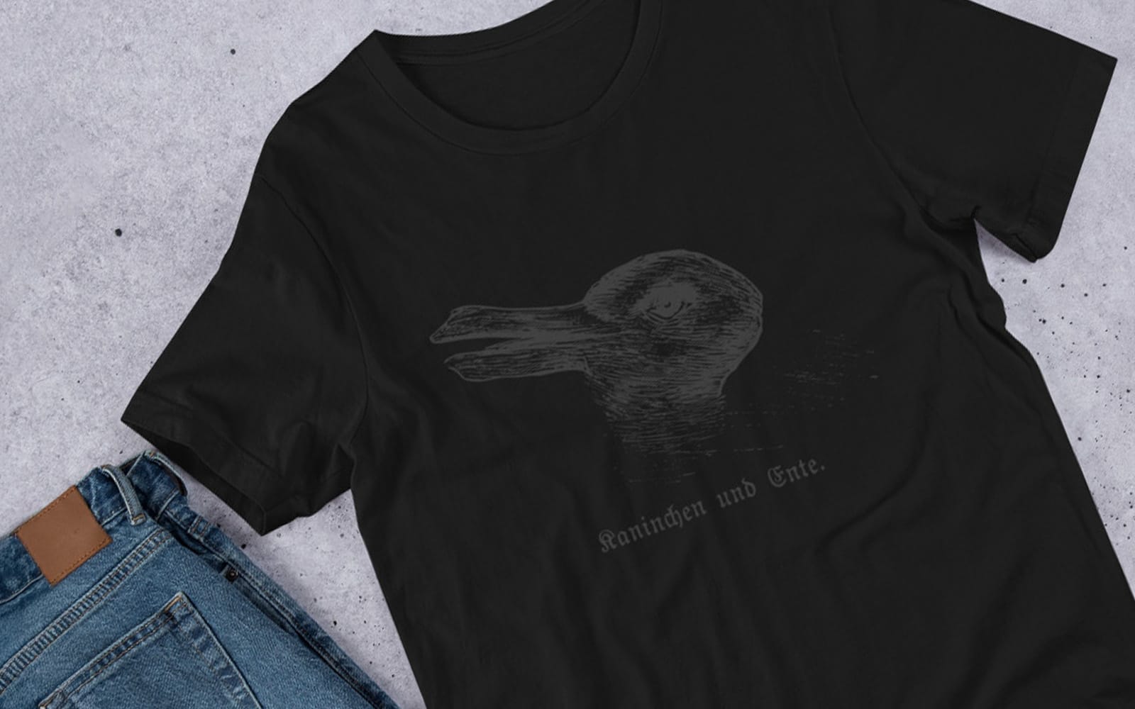 Rabbit-Duck Illusion Tee – Kaninchen und Ente Optical Trick Unisex Black-on-Black T-Shirt 